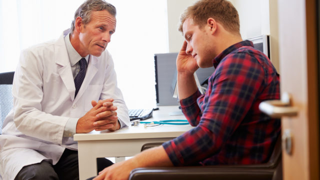 Doctor Treating Male Patient Suffering With Depression
